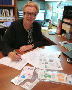 Susan Ritchie of NNEP signing patent paperwork